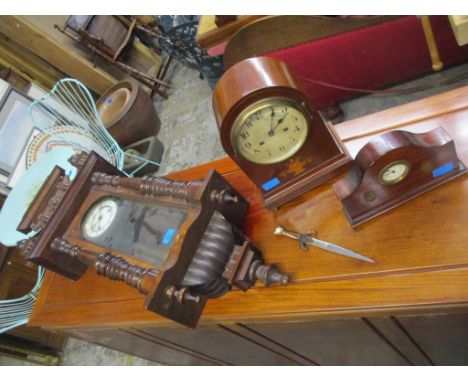 Three late 19th/early 20th century clocks to include an Edwardian inlaid mantel clock, a walnut eased Vienna style clock and 