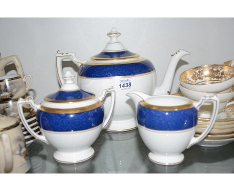 A Coalport tea pot and sugar bowl and cream jug in "Athlone Blue" blue with gold ring.