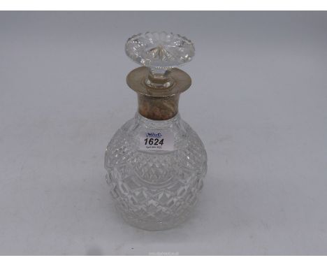 A Stuart cut glass decanter with a silver collar, Birmingham.