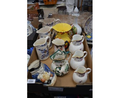 A quantity of jugs to include: a graduated set of three Coalport "The Caughley Mask Head Jug", Masons "Chartreuse", a porcela