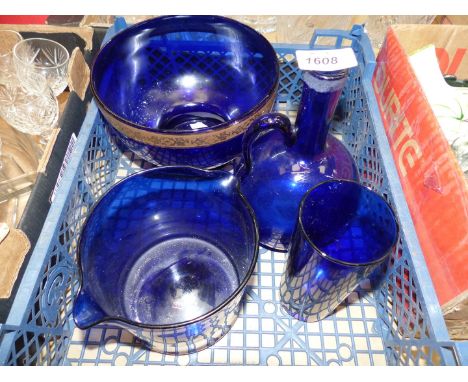 Four items of Cobalt blue glassware to include: a wine rinser, a flagon, beaker, etc.