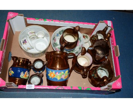 A quantity of lustre jugs, an oriental bowl, ramekins, a souffle dish, egg cups and relish pot.