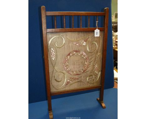 A late 19th century arts and crafts Oak Fireguard with original inset arts silk on silk tapestry, 31" tall x 18" wide.