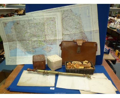 A quantity of miscellanea to include: two large wooden dice, a brass garden sprayer, a brown briefcase, hobby-made faux bread