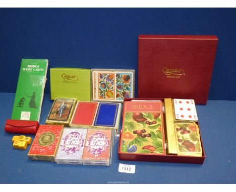 A quantity of playing cards, Waddingtons, Caspari bridge set, etc. plus a set of Chinese Dice (no cup).