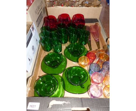 A quantity of glasses to include: green retro glasses (six medium and six small), plus a set of four "Vereco France" glass cu