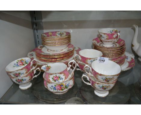 A Royal Albert "Lady Carlyle" part teaset to include seven cups and saucers, cake plate, six dinner plates, etc (some seconds