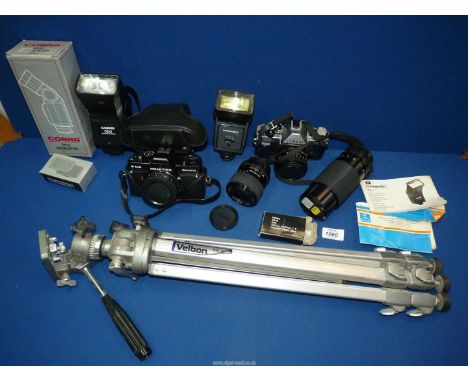 A Canon AE-I camera, a Praktica B100 camera, Sirius D71 zoom lens, Sigma lens, Hanimex flash, Cobra flash and a Velbon VS-3 t