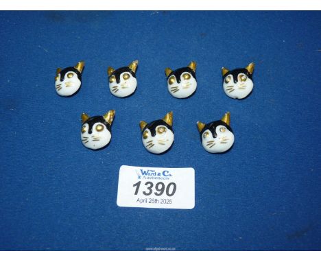 Seven delightful Louis Wain ceramic cat buttons.