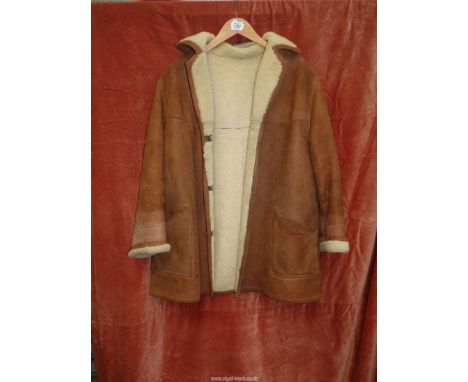 A ladies tan Sheepskin Coat, size small (some stitching loose), (as found).