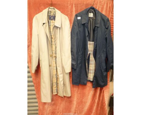 A Burberry's gentleman's Mackintosh/coat, a/f, (some marks on shoulder and repairs needed) plus a gent's Aquascutum navy mack