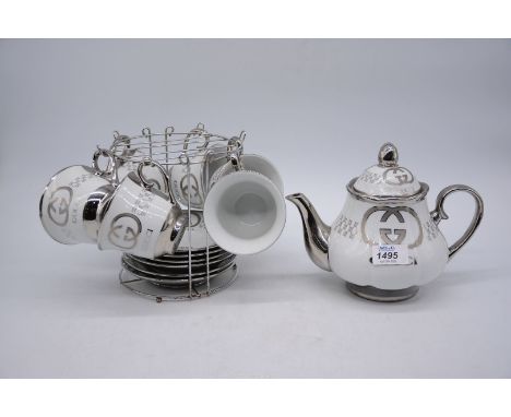 A six piece teaset to include: teapot and stand with designer style decoration.