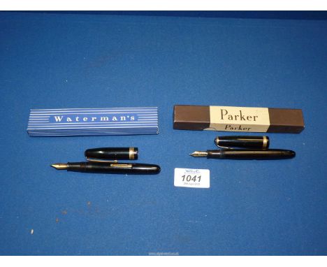 A black Waterman fountain pen with 14ct gold nib, plus a black Parker Duofold pen with 14ct gold nib, both boxed.