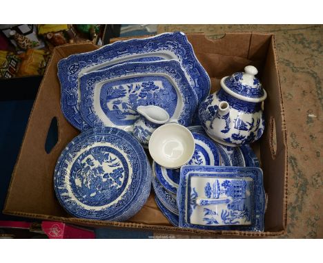 A quantity of blue and white "Willow'' pattern china to include: Royal Wessex soup bowls, Cheese dish, etc., Churchill teapot