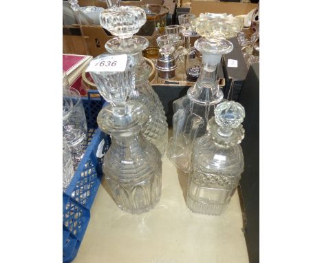 Three Decanters with stoppers plus another  smaller decanter with stopper .