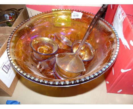 A Carnival glass punch bowl set.