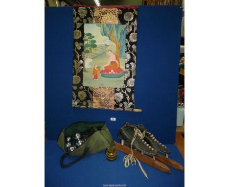 A pair of antique ice skates, a set of brass weights, a set of lawn bowls for Boules and a Chinese painting on a scroll.