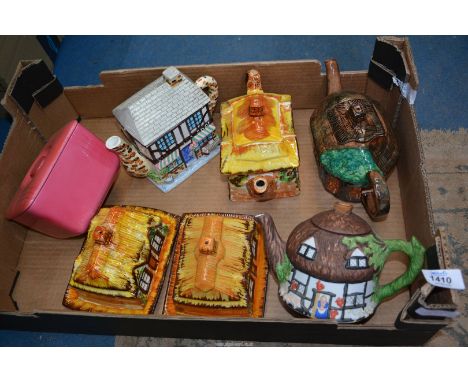A quantity of Cottageware teapots and butter dishes to include: Price Bros., Tony Woods and a pink Royal Doulton butter dish.