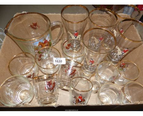 A set of vintage hunting scene Glasses with gilt rims to include; jug/pitcher, long glasses, short glasses and shot glasses.
