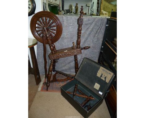 An Oak Spinning Wheel with carved and bobbin turned detail, plus a box of components/ accessories.