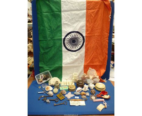 A quantity of miscellanea including a flag of India, shells, advertising items, a Churchill Crown, a Voigtlander range-finder