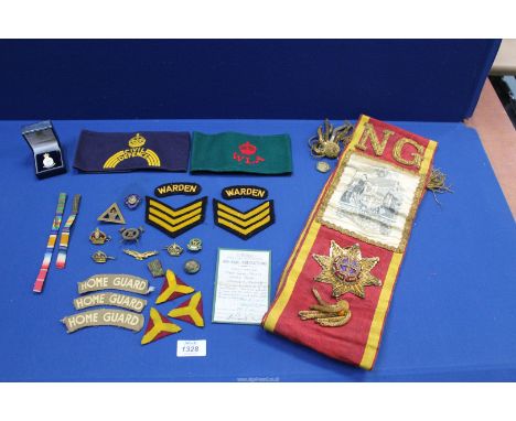 A quantity of militaria incl. a Civil Defence arm band and women's Land Army armband, medal ribbon bar with mention in dispat