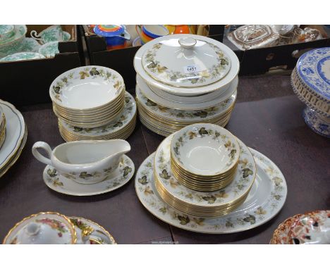 A Royal Doulton "Larchmont" Dinner service to include: ten dinner plates, two lidded tureens, gravy boat and saucer, meat pla