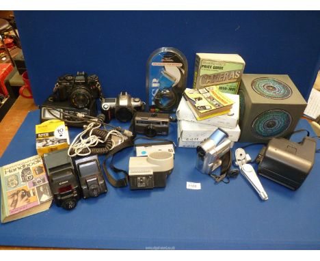 A box of cameras to include; Nikon F65 camera, Polaroid, Chinon CE-5, etc and a Doctor Who "Disc box".