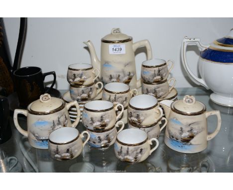 A Japanese eggshell twelve piece coffee set to include: twelve cups, ten saucers, coffee pot, sugar and cream.