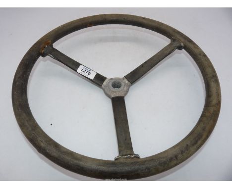 An old motor car, three spoke Steering Wheel, the central aluminium boss (20-21mm diameter) with tapering spline fixing, 15" 