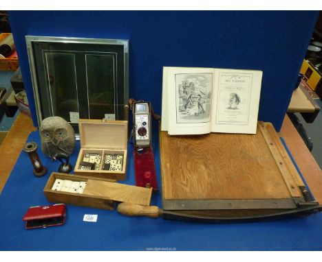 A quantity of miscellaneous to include: a paper guillotine, two cases of dominoes, a stone owl, an egg timer, a Bell & Howell