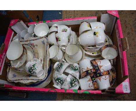 A quantity of china to include: rose decorated part teaset comprising four cups, saucers and five side plates, a navy and bro