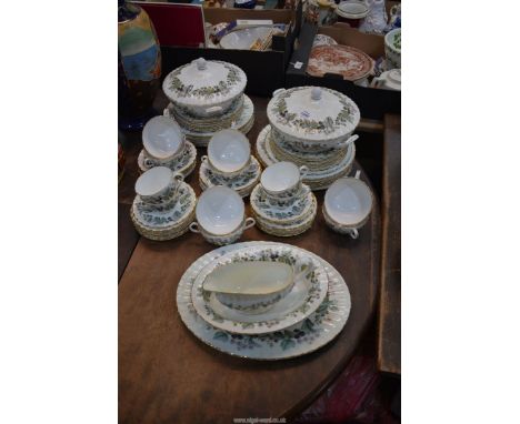 A Royal Worcester "Lavinia" dinner service to include: twelve of each dinner and side plates, eight of each soup coups and st
