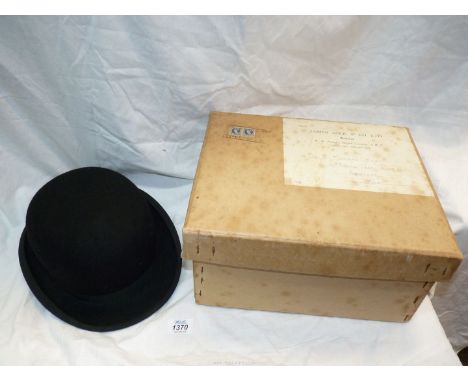 A Lock & Co bowler Hat in delivery box.