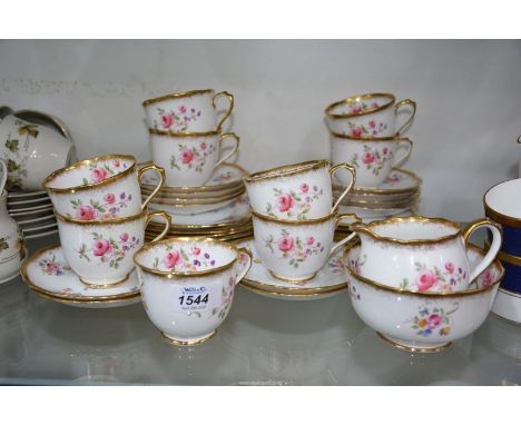 A Royal Albert bone china tea service to include: twelve sauce and tea plates, nine tea cups, a sugar bowl and milk jug with 