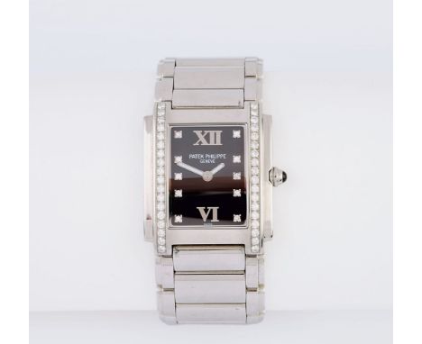 Patek Philippe. Damen-Armbanduhr 'Twenty 4'. Edelstahl, Quarz. Schwarzes Zifferblatt, 10 Diamant-Indizes, illuminierte Zentra