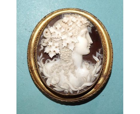 A 19th century shell cameo brooch, well-carved with female Bacchanalian portrait, indistinct signature to reverse, in unmarke