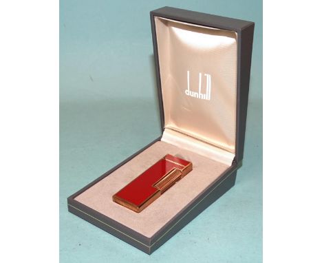 A Dunhill gilt metal and red/brown Rollagas lighter, (boxed). 