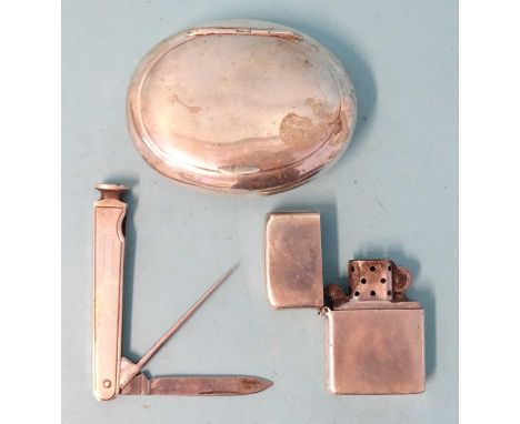A silver tobacco box of oval form, Birmingham 1918, ___2.93oz, a silver-sided penknife/tamper, Sheffield 1963 and a silver ci