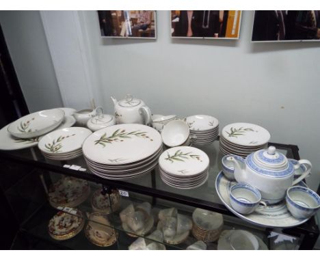 Sixty pieces of Meiko china comprising plates, cups, saucers, bowls and similar and a blue and white Chinese tea set comprisi