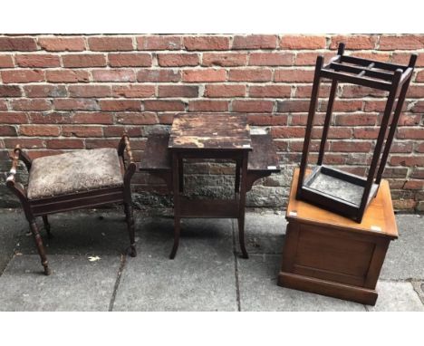 A piano stool with hinged, floral upholstered top, a four-section umbrella stand and a jardiniere stand, together with a comm