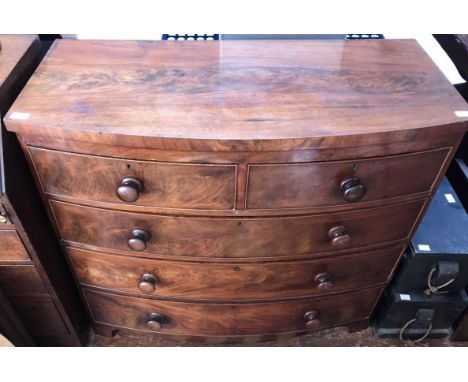 A 19th century mahogany bow-front chest of two short, over three long graduated drawers, raised on bracket feet. 106cm wide 