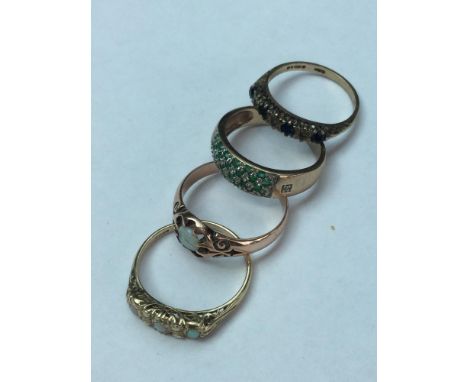 4 9ct gold dress rings, including 2 opal rings, 1 Australian sapphire and 1 emerald pave set ring. Total weight of rings 9.7 