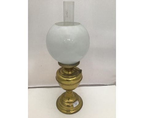 A Duplex brass oil lamp with white glass globe shade and clear glass flu, 53cm high 