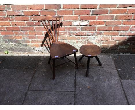 An oak pokerwork tripod milking stool, the top decorated with leaves and reads 'Touch Me Wha Daur' (Touch me if you dare) And