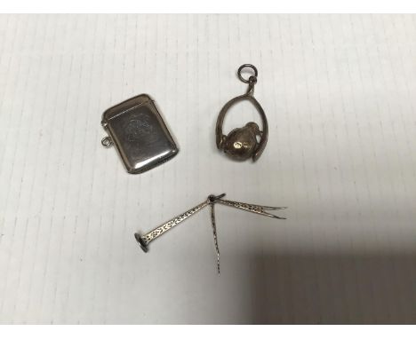 Three small silver items comprising a pipe tamper by George Edwin Walton &amp; Co Ltd, hallmarked Birmingham, 1902, a vesta c