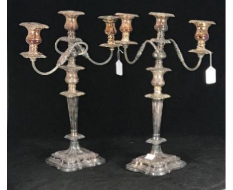 A pair of three light candelabra by Viner's &amp; Co. with removable sconces, ornate and foliate branches, raised on shaped, 