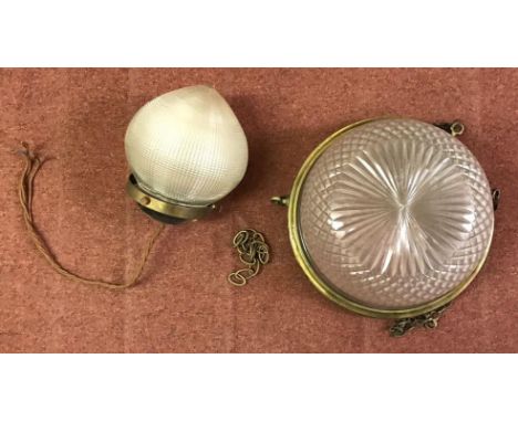 A small Holophane style prismatic glass light shade of globular form with pointed base and brass fittings, 16cm tall, togethe