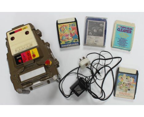 A 1978 Mego Corp 2-XL educational toy robot with 8 track tape player, together with a small selection of assorted 8 track tap