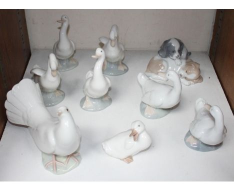 SECTION 23.  A large Lladro porcelain dove, together with six Nao geese, a Nao duck and a Nao puppy group (9) 